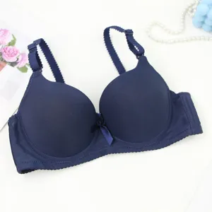 Seamless smooth push-up bra detail view, comfortable dark blue fabric and delicate straps.