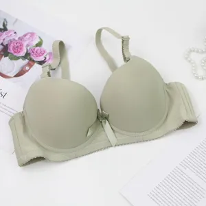 Detailed view of a sage green solid color seamless push-up bra for women, smooth design.