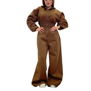Detail shot of the brown hooded jumpsuit, featuring front zipper and cinched waist design.