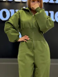 Detailed view of the solid olive green hooded long sleeve zip jumpsuit, casual waist design.
