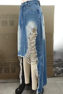 High-waist distressed denim skirt with asymmetrical frayed hem, perfect for street fashion look.