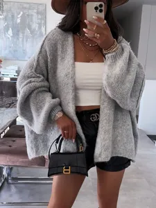 Grey oversized knit cardigan detail view, casual long sleeve V-neck autumn winter outerwear.