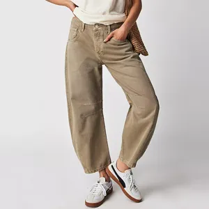 Detail view of casual loose khaki wide-leg denim jeans for women, comfortable fit.