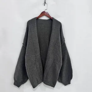 Detailed view of the casual loose knit cardigan sweater, featuring long sleeves and V-neck.