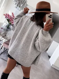 Close-up of casual grey loose knit sweater, comfortable autumn oversized long sleeve pullover.