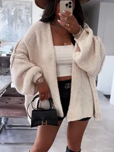 Women's oversized V-neck knit cardigan, casual solid color long sleeve sweater jacket detail view.