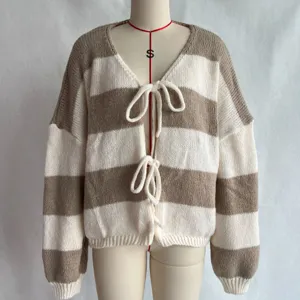 Detail shot of the striped knit cardigan showing the front tie closure and soft knit texture.