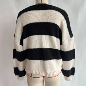 Black and white striped loose casual knitted sweater for women, perfect for autumn and winter wear.