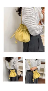 Sac seau élégant en cuir jaune avec cordon pour femme, design polyvalent bandoulière et épaule.