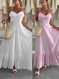 Close-up detail showing the gathered bust and ruffled hem of the resort style maxi dress.