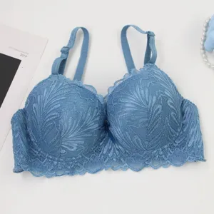 Detail view of blue full lace underwire bra with delicate floral pattern and adjustable straps.