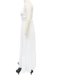 Side detail of a white solid strap backless long dress, elegant vacation resort style.