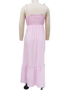 Pink backless maxi dress with spaghetti straps and ruffled hem, elegant resort style back view.