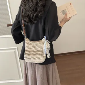 Handmade woven crossbody bag for women, stylish knitted shoulder bag with lace and pearls.