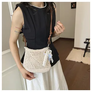Handmade crochet shoulder bag for women, stylish casual mesh crossbody bag with pearls and charm.