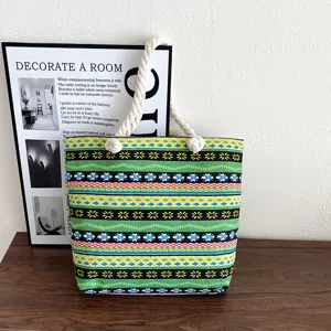 Ethnic style canvas tote bag with thick rope handles, casual multi-color geometric pattern.
