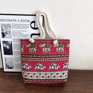 Ethnic style red canvas tote bag with elephant pattern and thick hemp rope handles for daily use.