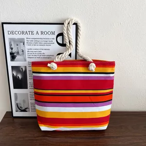 Detailed view of the colorful striped canvas tote bag with thick rope handles for daily use.