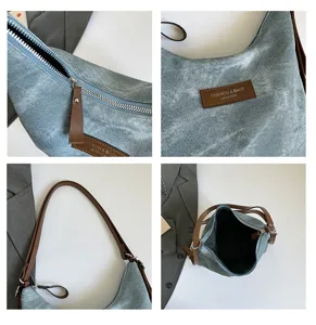 Dettaglio borsa a spalla in denim, stile casual vintage con cinturini in pelle marrone.