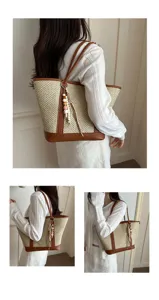 Stylish women straw woven shoulder bag with brown leather trim and cute beaded charm pendant.
