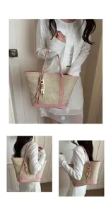 Chic summer straw tote bag with pink pu leather trim and cute wooden bead pendant for women.