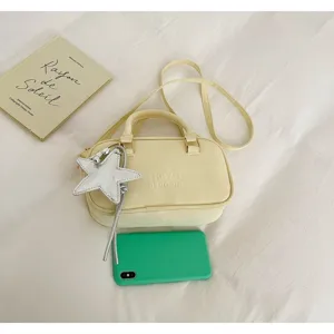 Minimalist yellow shoulder bag with star pendant, casual crossbody small square bag.