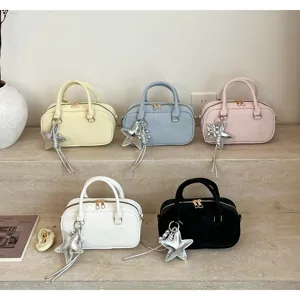 Korean style fashion women handbag shoulder crossbody bag with star charm detail.
