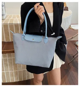 Casual large capacity shoulder tote handbag for women, versatile commuting fashion bag.