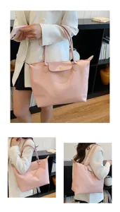 Pink large capacity tote bag detail view, casual soft shoulder bag for daily commuting.