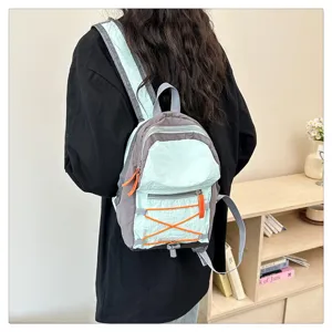 Lightweight fashion backpack for women and student school bag with color block design.