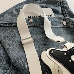 Guitar shape shoulder bag white strap detail view, stylish contrast design, premium hardware.