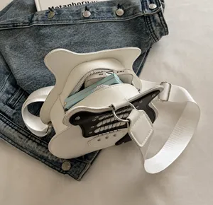 Detail view of the guitar shaped crossbody bag capacity showing interior space clearly.