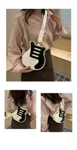 Detail view of the trendy guitar shaped crossbody bag, unique black and white color block.
