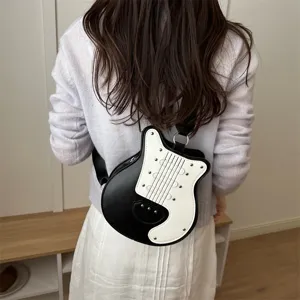 Guitar shaped crossbody bag, stylish black and white contrast design for women.