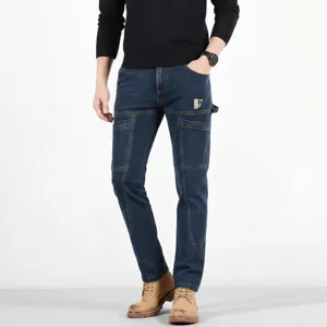 Men's slim fit straight cargo denim jeans casual multi-pocket blue pants detail view.