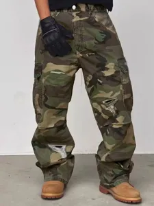Detailed shot of streetwear camo cargo pants with multi pockets and distressed ripped styling.