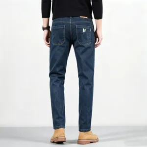 Men's slim fit straight leg denim jeans in dark blue, back view detail showing pockets.