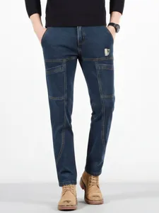 Men's casual straight fit denim jeans featuring multi pockets and stylish panel stitching.