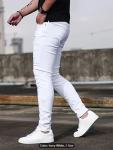 Detailed view of men white ripped skinny jeans, showing slim fit design and street style.