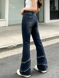 High-waist flare denim jeans for women featuring stylish frayed layered cuffs and a slim fit dark wash look.