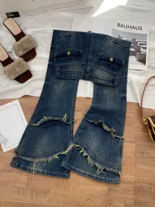 Distressed high waist flared denim jeans featuring raw hem and back pockets for women.