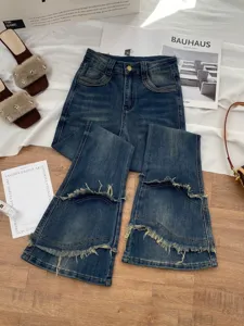 Women's blue denim jeans slim fit micro flared trousers with spliced frayed raw edge details