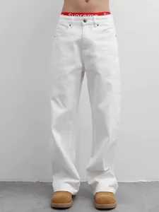 White denim jeans detail view, relaxed straight leg fit, stylish high streetwear style pants.