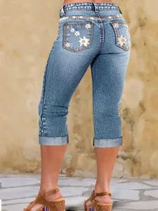 Vaqueros capri de mujer elásticos y ajustados con bonitos bordados de margaritas