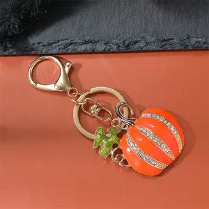 Close-up detail of the rhinestone enamel pumpkin keychain with lobster clasp, perfect holiday charm.