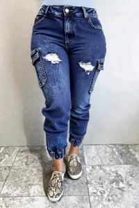 Detail shot of women's blue cargo denim jeans with distressed rips and elastic cuffs.