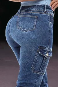 Close up of women blue cargo jeans back view, showing elastic slim fit and side pocket detail.