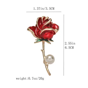 Exquisite red enamel rose brooch detail showing gold stem and elegant white pearl accessory.