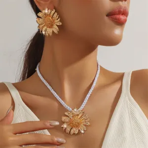 Gold sunflower jewelry set, elegant floral earrings and rope necklace for summer beach.