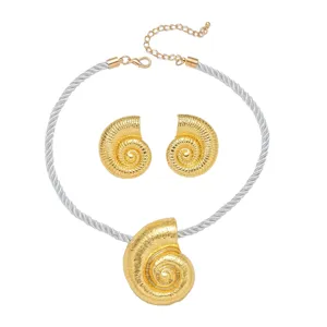 Gold-tone conch shell necklace and earrings set, beach vacation style jewelry accessory.